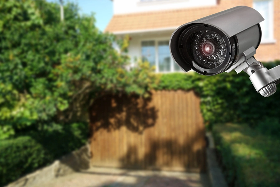 Outdoor security camera on a side of a home